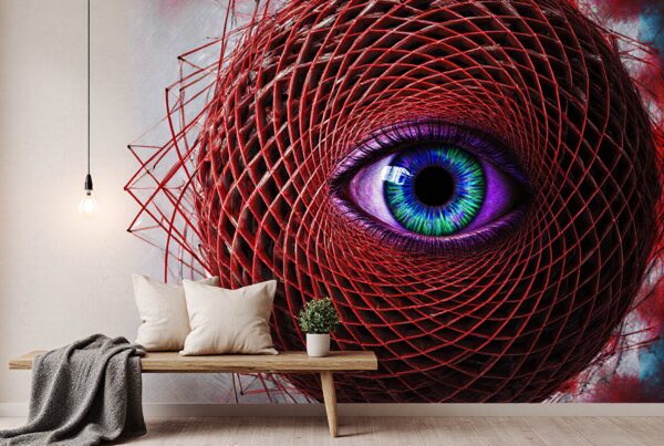 A vibrant room features an eye mural enveloped in red geometric design, complemented by minimalist decor and warm lighting.