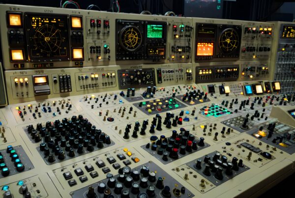 A retro control room filled with vintage consoles, knobs, and glowing radar screens.