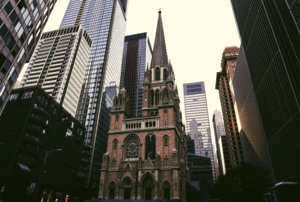 Historic Church Amidst Modern Skyscrapers