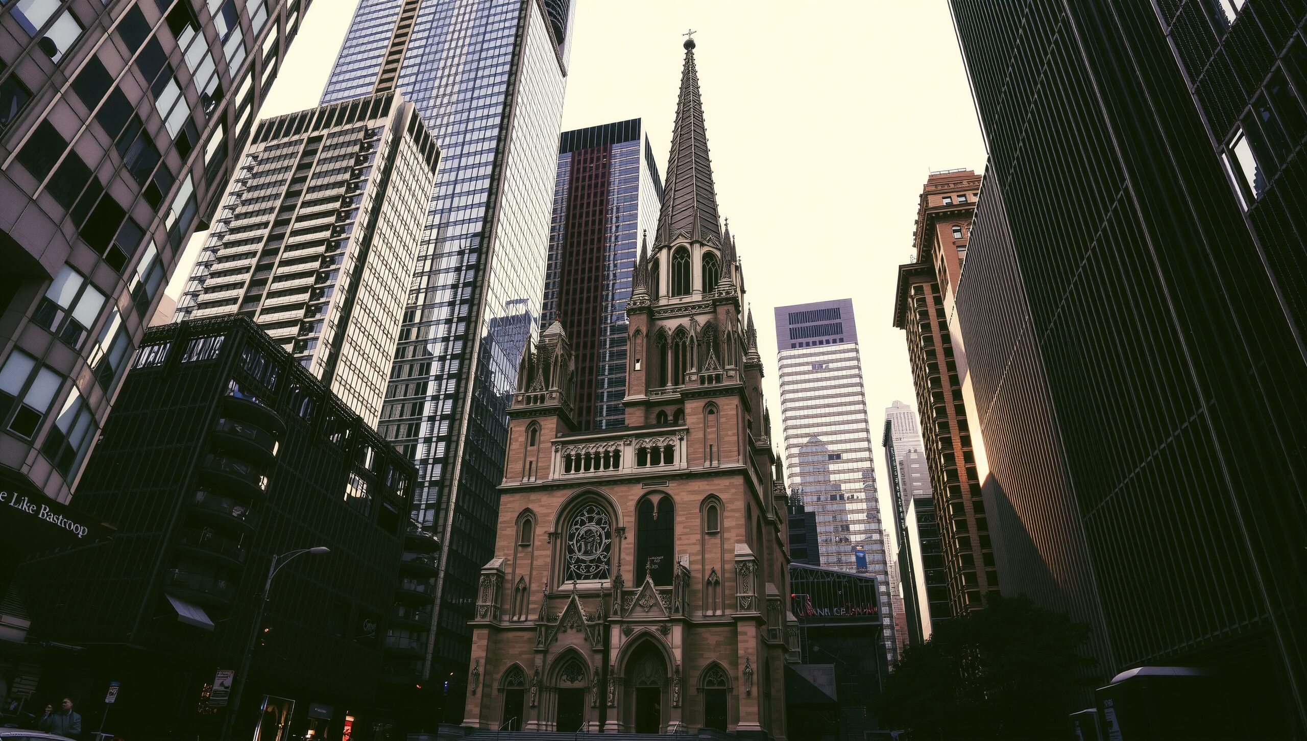 Gothic church surrounded by skyscrapers