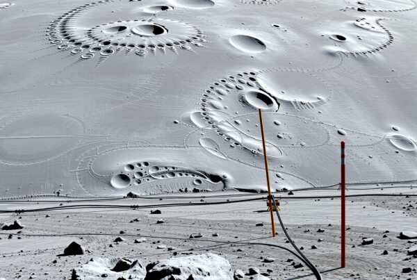 Futuristic lunar base with alien architectural structures and survey poles