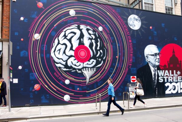 Vibrant street mural featuring a brain, planets, and Wall Street theme.