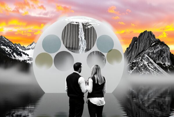 A couple admires a surreal mountain landscape with celestial structure at sunset.