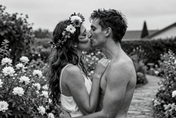 Romantic couple sharing passionate kiss amidst blooming garden roses