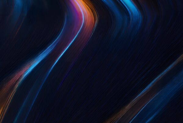 A vibrant abstract image with flowing blue, purple, and orange lines on a dark background.