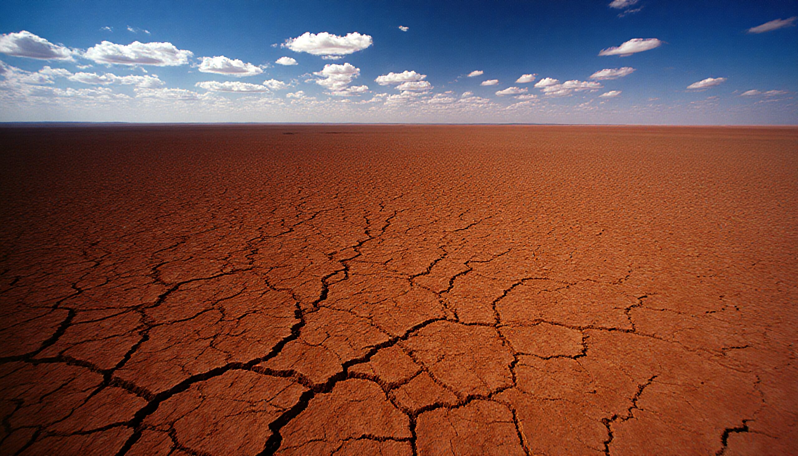 Cracked Desert Earth under Sky