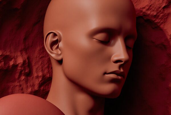 A serene, sculptural bust against a textured red background, highlighting tranquil expression and smooth features.