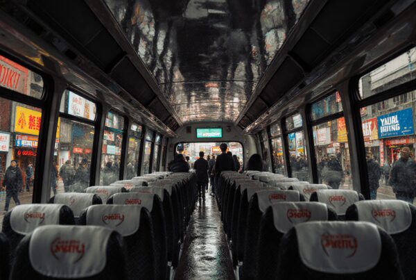 Empty bus interior with rain-soaked windows reflecting vibrant city lights and moving pedestrians.