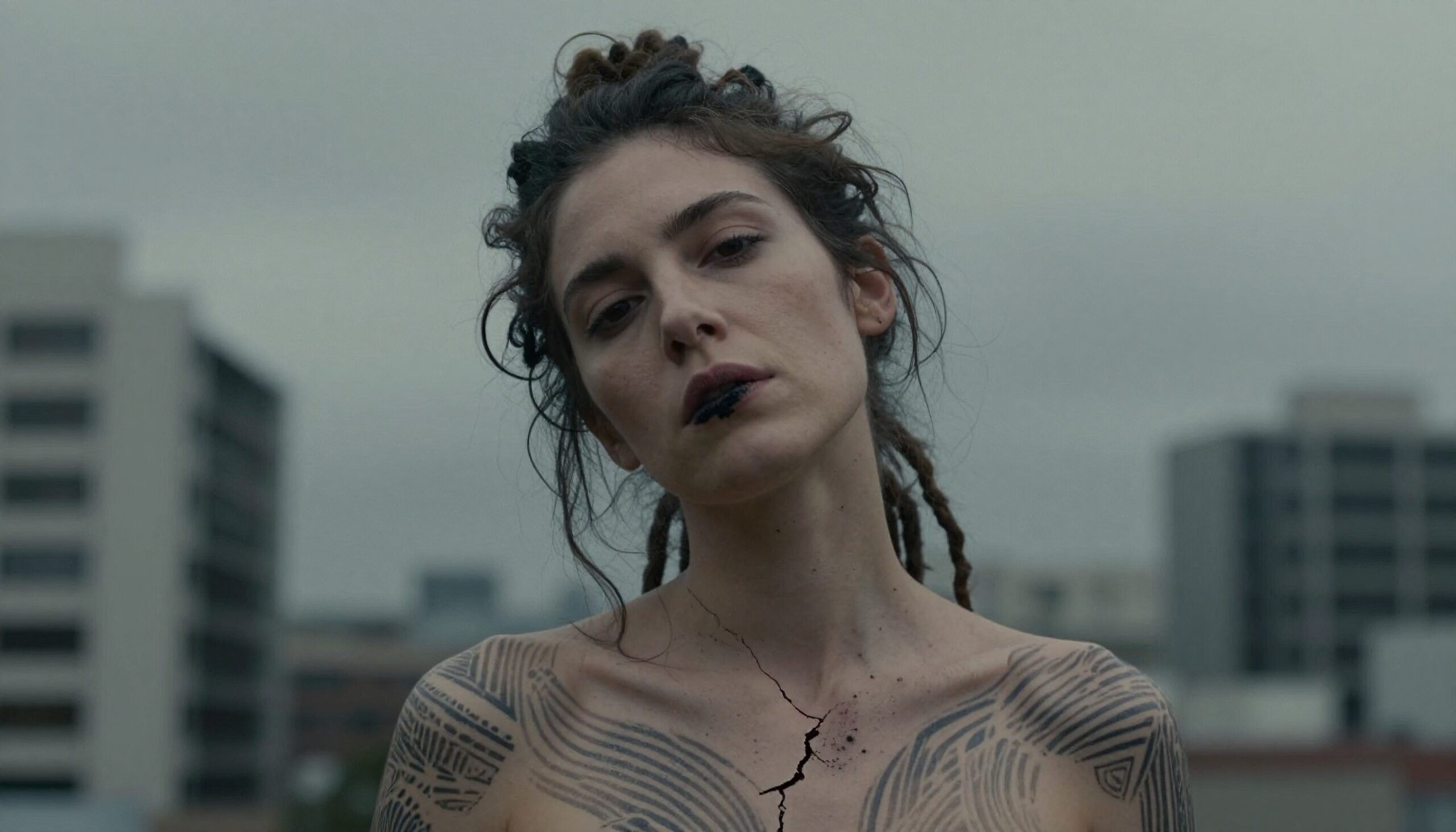 Tattooed woman with cracked skin