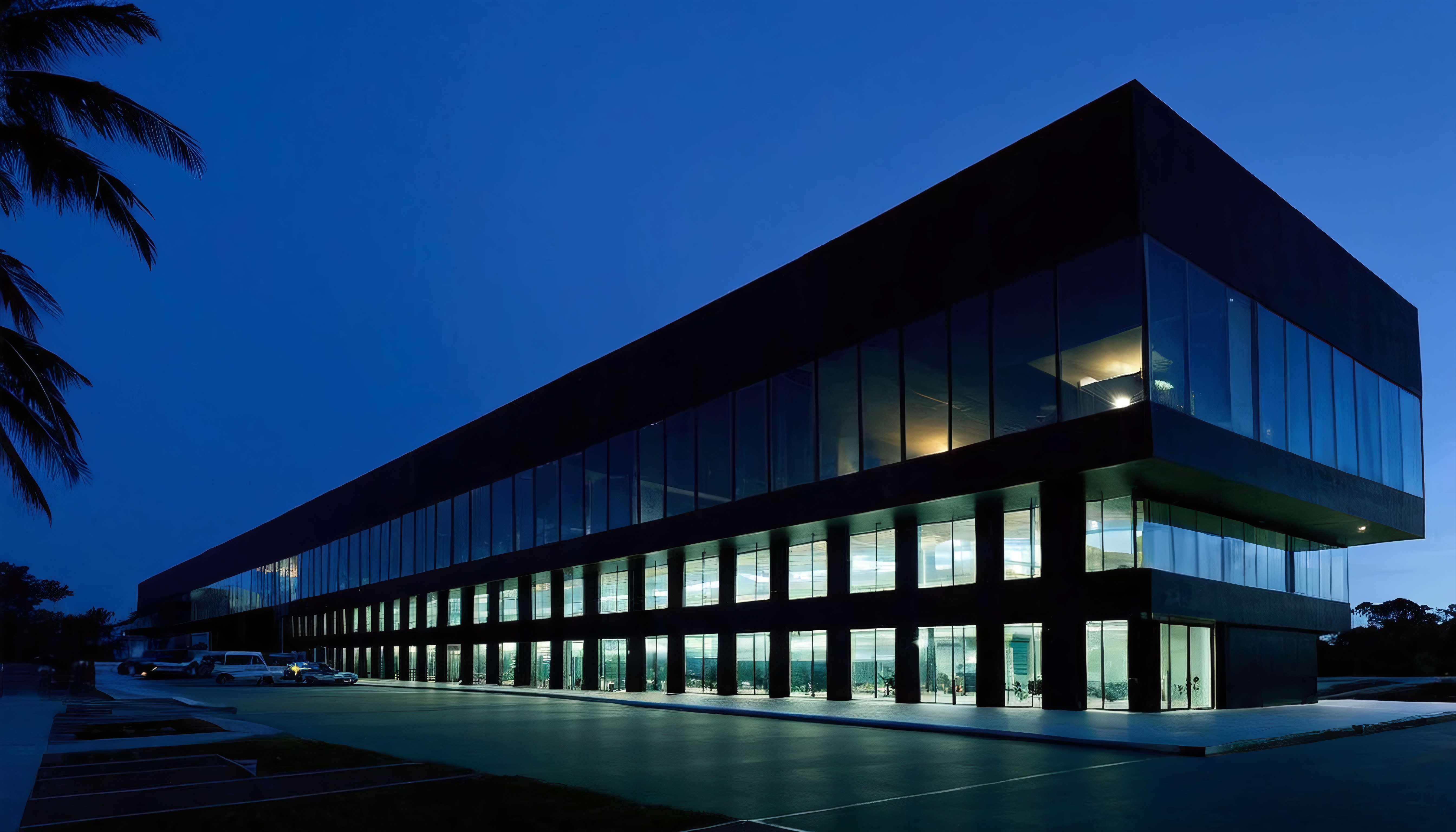 Modern Corporate Building with Glass Facade at Dusk