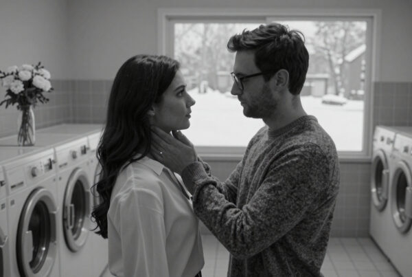 Intimate couple sharing tender moment inside laundry room during winter