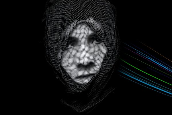 A digital portrait with a mesh overlay and colorful radiating lines.