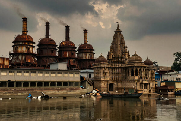 Ancient Hindu temple next to decaying industrial plant reflecting in polluted river under stormy skies