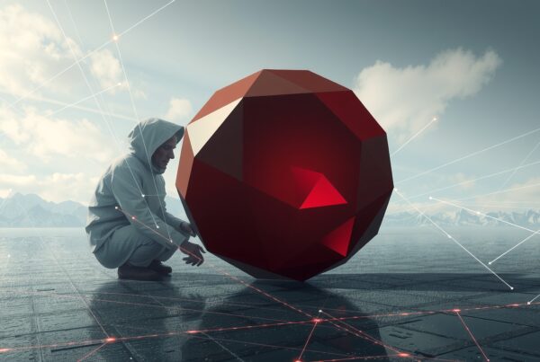 A hooded figure examines a red geometric object on an icy plain with mountains in the background.