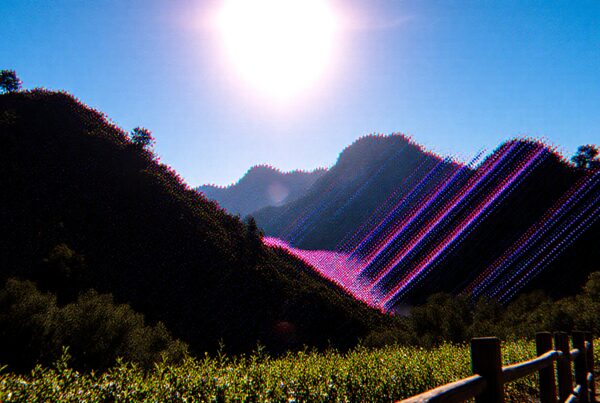 Abstract landscape art with digital glitch effect showcasing mountains and vibrant scenery.