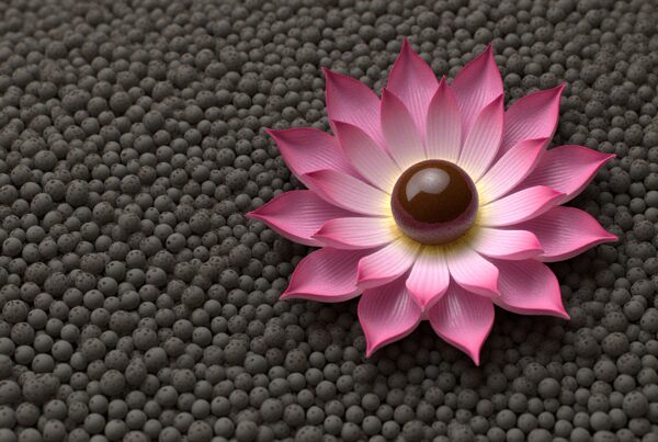 Pink flower with sharp petals resting on a textured gray sphere background.