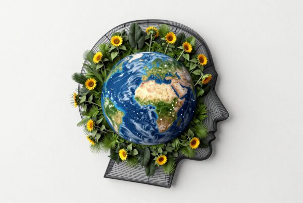 Image depicting a globe inside a human head silhouette with vibrant sunflowers and green leaves, symbolizing environmental harmony and awareness.