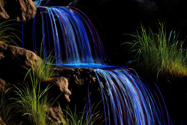 Vibrant colors cascade over rocky waterfall.