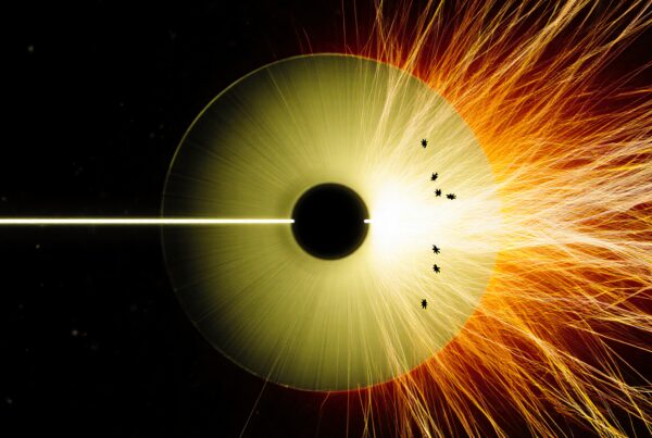 Circular welding process emitting fiery sparks in a dark setting.