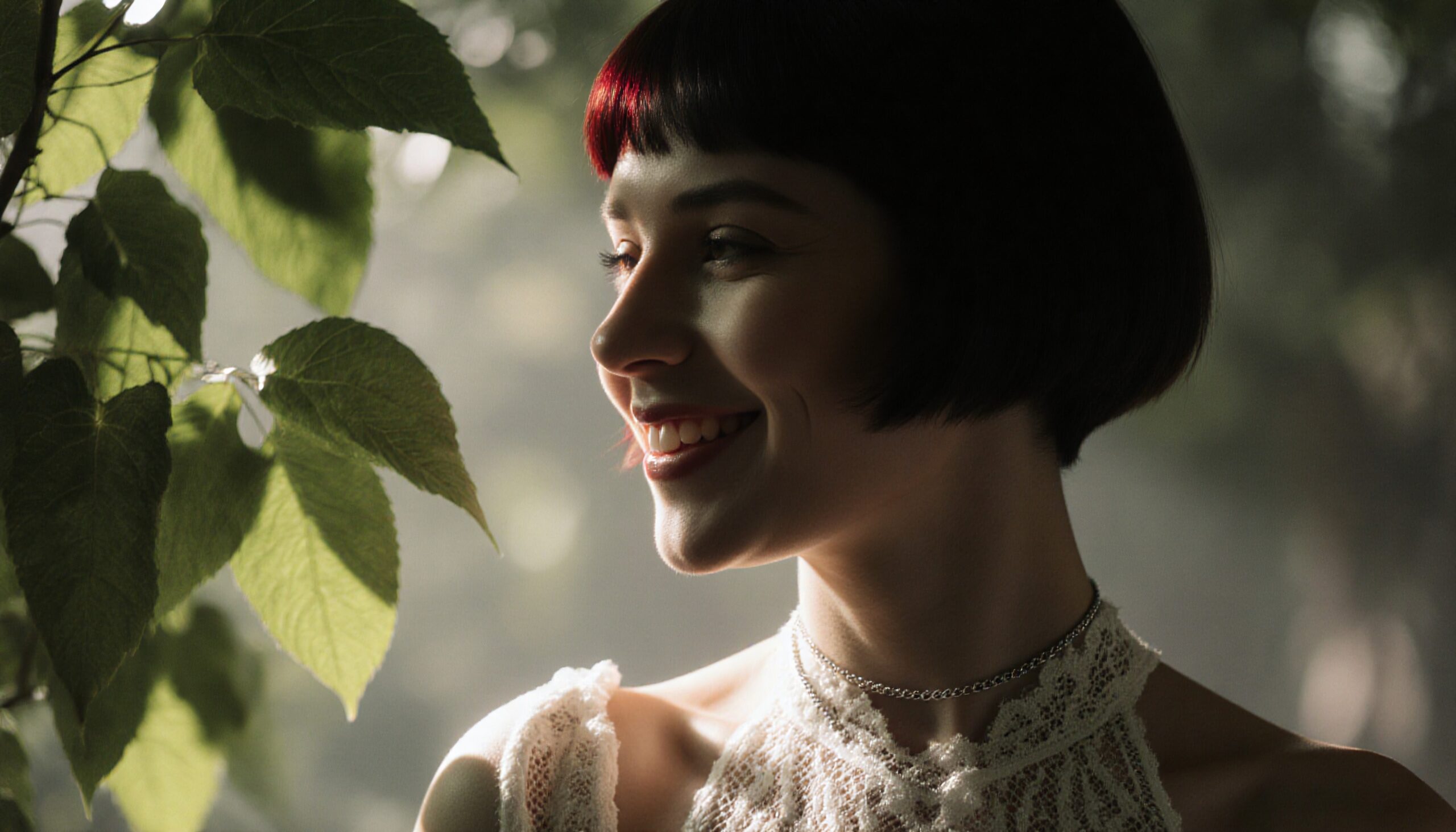 Woman Smiling Among Sunlit Leaves