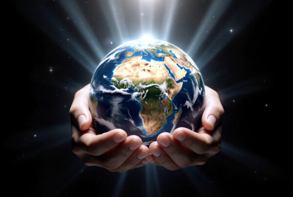 Hands cradling Earth, symbolizing global unity and responsibility in a dark cosmic setting.