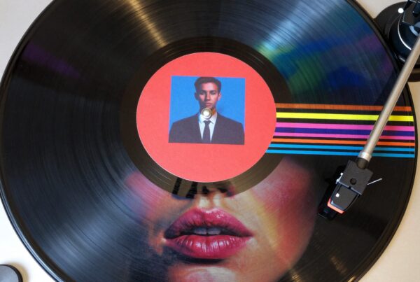 Colorful vinyl record spinning on a turntable with unique label.
