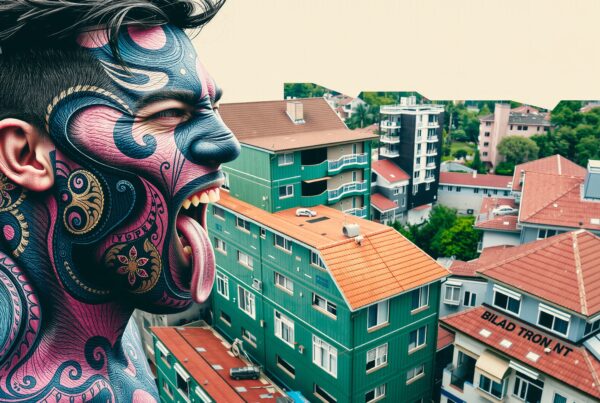A tattooed man overlooks a colorful urban cityscape with vibrant rooftops and residential buildings in the background.