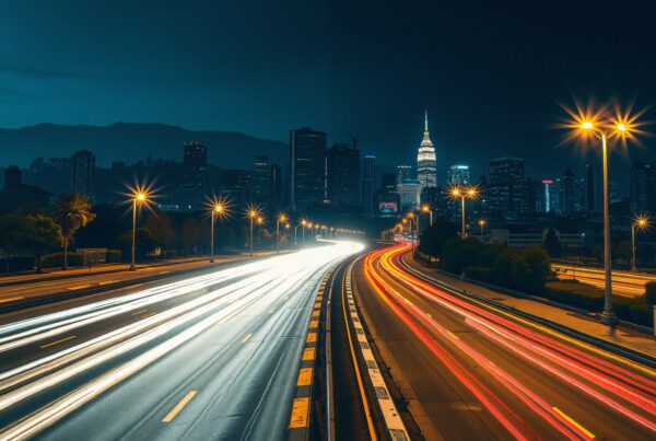 A bustling urban highway at night, under a luminous city skyline.