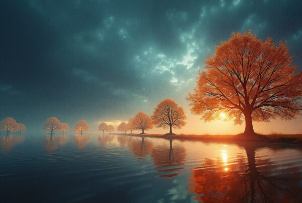 A row of vibrant orange trees reflected in calm water under a dramatic blue sky at sunset.