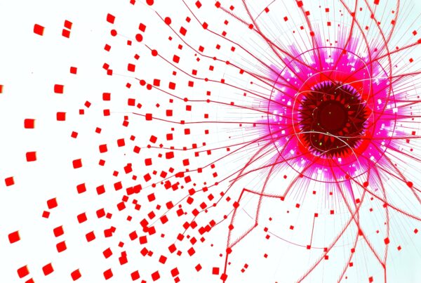 Abstract digital artwork featuring a vibrant explosion of red and pink geometric shapes with radiating lines on a white background.