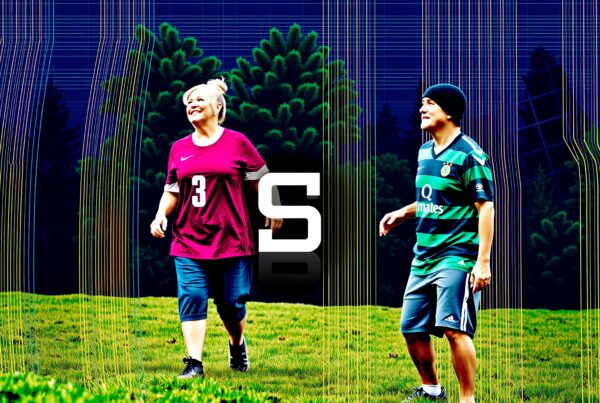 Two people in jerseys walking on grass with colorful lines.
