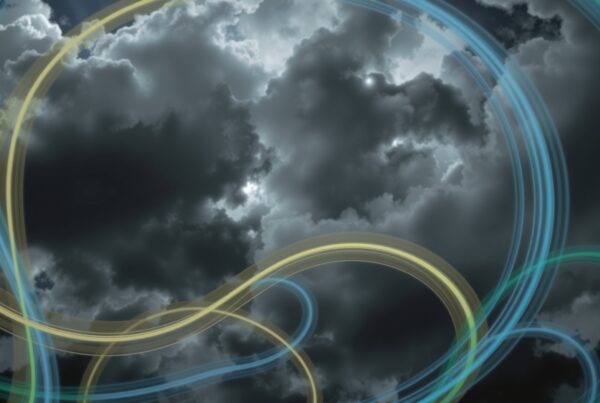 A dramatic sky with swirling clouds and illuminated light trails, adding energy and mystery.