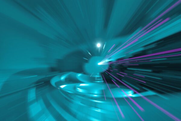 Dynamic futuristic scene with vibrant turquoise and pink streaks and central glowing light.