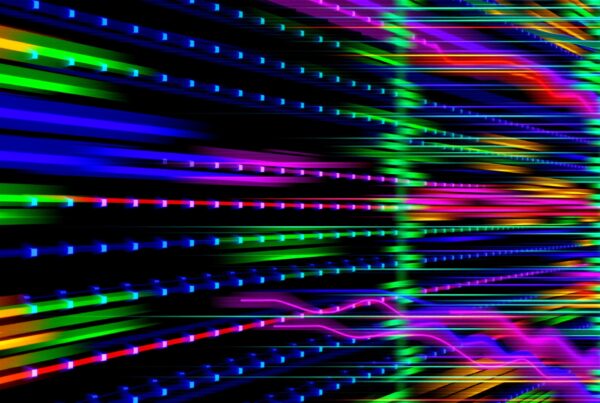 A dynamic display of vibrant neon lights in motion, featuring blue, green, pink, orange, and purple hues against a black background, creating a futuristic digital aesthetic.