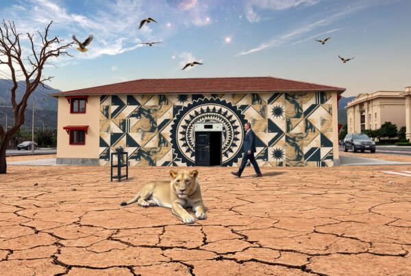 A surreal landscape features a lion resting on cracked earth in front of a mural-covered house, set under a sky with birds and galaxies.